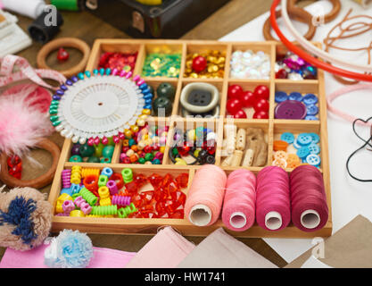 set of accessories and jewelry to embroidery, sewing accessories top view, seamstress workplace, many object for needlework, embroidery, handmade and  Stock Photo