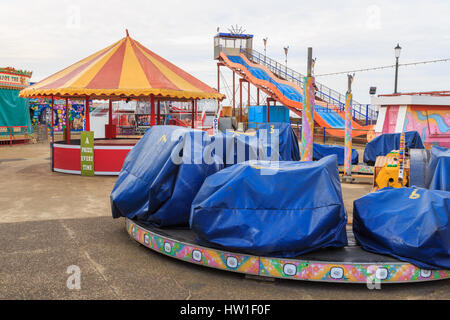 HUNSTANTON, ENGLAND - MARCH 10: Hunstanton fairground rides during closed/off time. In Hunstanton, Norfolk, England. On 10th March 2017. Stock Photo