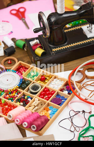sewing machine and set of accessories to embroidery, haberdashery, sewing accessories top view, seamstress workplace, many object for needlework, hand Stock Photo