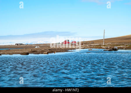 Lonely house at the coast near Longyearbyen, Svalbard, Arctic Stock Photo