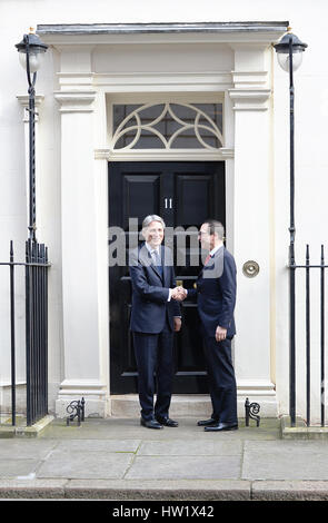 Chancellor Philip Hammond (left) greets US Treasury Secretary Steven Mnuchin outside his official residence at No 11 Downing Street, London, ahead of a meeting. Stock Photo