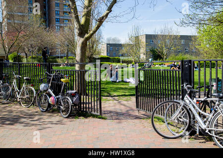 London, United Kingdom - April 17, 2015: Spring scene from life. People rest on the lawn Stock Photo
