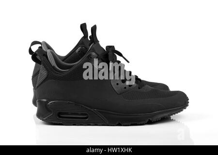 trendy black casual sneakers isolated on white background Stock Photo