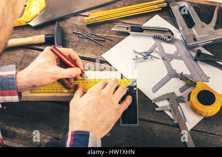 diy - carpenter working on new table project in workshop Stock Photo