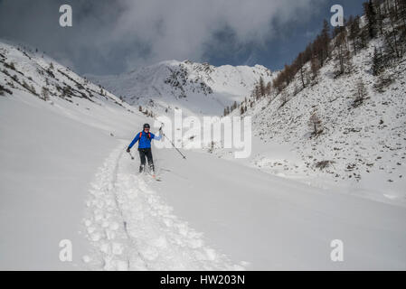 Ski tourers exploring the mountains of the Villgratental in Ost Tirol of Austria near the South Tirol border with Italy Stock Photo