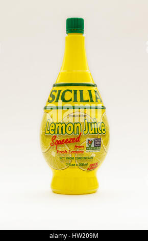 Bottle of Sicilia lemon juice isolated on white background. Stock Photo