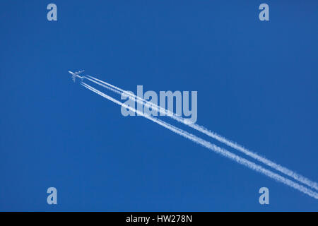 A KLM Royal Dutch Airlines Boeing 747 at High Altitude Crossing the Southe East of England en-route to Surinam Against a Clear Blue Sky Stock Photo