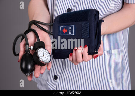 Nurse holding blood pressure measuring kit Stock Photo