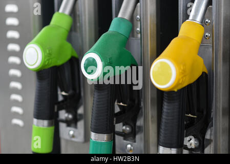 Nozzles on a fuel dispenser machine at a petrol station