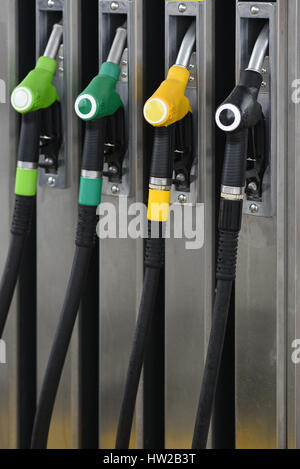 Nozzles on a fuel dispenser machine at a petrol station Nozzles on a fuel dispenser machine at a petrol station