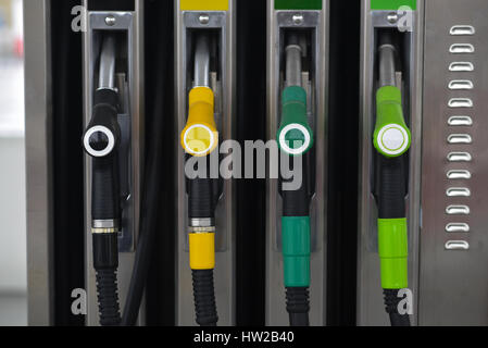 Nozzles on a fuel dispenser machine at a petrol station Nozzles on a fuel dispenser machine at a petrol station