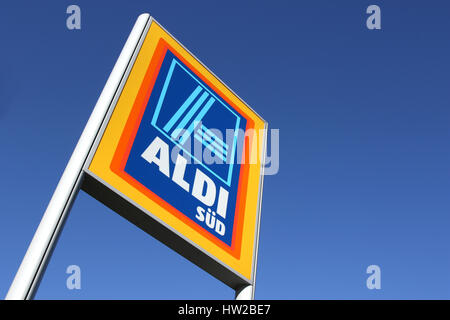 Aldi sign (south division) against blue sky. Aldi is a leading global discount supermarket chain with almost 10,000 stores in 18 countries. Stock Photo