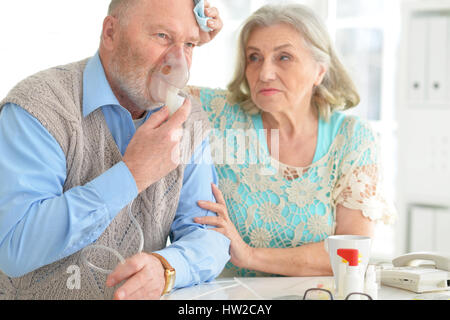 Elderly couple with pills Stock Photo
