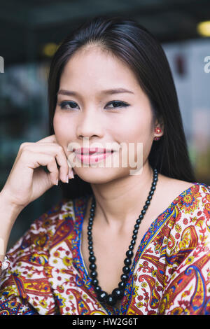 Portrait of smiling Asian woman Stock Photo