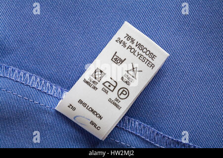 care instructions, washing instructions, label in woman's blue jacket from BHS 76% viscose 24% polyester Stock Photo