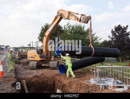 Drainage pipework being installed under a new section of the A5 near Nuneaton. Civil engineering, road construction, development, infrastructure Stock Photo