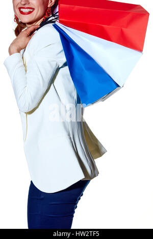 Shopping. The French way. Closeup on happy young woman with French flag colours shopping bags on white background Stock Photo