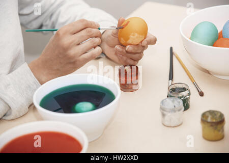Woman preparing Easter eggs Stock Photo