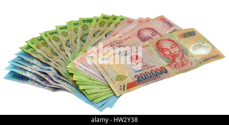 Vietnamese currency including 500,000, 200,000, 100,000 and 20,000 Dong notes all featuring the smiling face of Ho Chi Minh. Isolated on a white backg Stock Photo