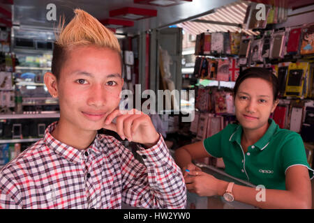 Sales persons at a mobile phone store in Maha Bandoola Road, Yangon, Yangon Region, Myanmar Stock Photo