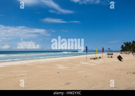 Colourful flags on the white sand beach at Kabalana, Ahangama, Sri Lanka Stock Photo