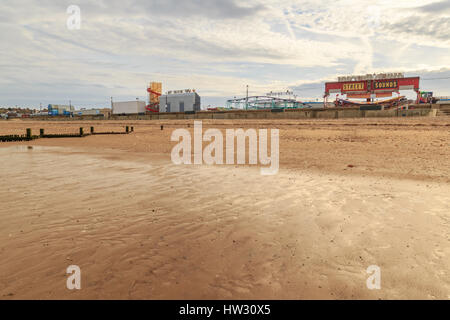 HUNSTANTON, ENGLAND - MARCH 10: Hunstanton fairground from the beach. HDR image. In Hunstanton, Norfolk, England. On 10th March 2017. Stock Photo