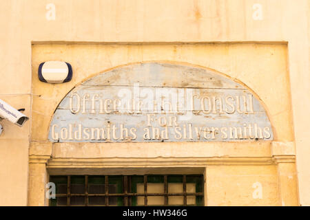 The sign above the door to the Office of the Consul for Goldsmiths and Silversmiths on an old building on Valetta Malta Stock Photo