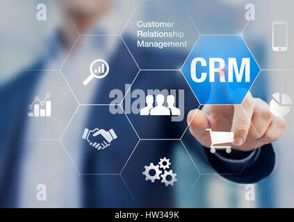 Customer relationship management concept with businessman touching button in background, communication, marketing and sales processes automation Stock Photo