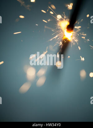 Sparkler burning and glowing in the dark Stock Photo