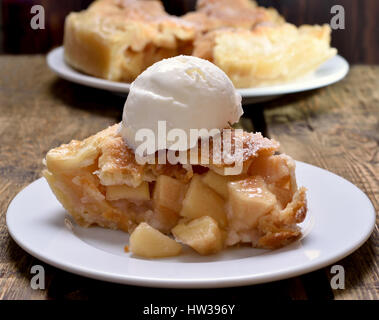 Piece of apple pie served with ice cream, close up view Stock Photo