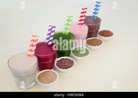 High protein and health supplement drinks of maca root, acain berry, wheat grass, pomegranate fruit,  and chocolate whey. Also used by body builders. Stock Photo