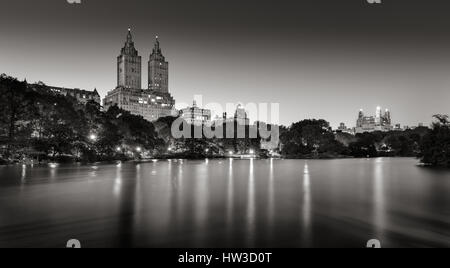 Central Park and city lights across The Lake at twilight. Black & White. Upper West Side, Manhattan, New York City Stock Photo