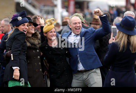 Zara Tindall (second Left), Dolly Maude and Mike Tindall pose for a photo during St Patrick's Thursday of the 2017 Cheltenham Festival at Cheltenham Racecourse. Stock Photo