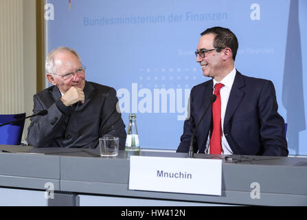 Berlin, Germany. 16th Mar, 2017. German Finance Minister Wolfgang Schaeuble (L) talks with visiting U.S. Treasury Secretary Steven Mnuchin after a joint press conference after their meeting in Berlin, capital of Germany, on March 16, 2017. Credit: Shan Yuqi/Xinhua/Alamy Live News Stock Photo