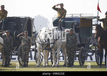 Kathmandu, Nepal. 17th Mar, 2017. Nepalese Army soldiers salute while displaying their chariot during the rehearsal for upcoming Ghode festival or Horse Parade at Tundikhel in Kathmandu, Nepal on Friday, March 17, 2017. According to myths it is believed that Ghode Jatra is celebrated as triumph over the demon that once was a horror in the city and by galloping horses the demon spirit stays under the ground. Credit: Skanda Gautam/ZUMA Wire/Alamy Live News Stock Photo