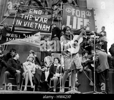 May 05, 1965 - Peace In Vietnam Meeting In Trafalgar Square: The American folk singer and freedom marcher Joan Bafz, lead a march to stop the War in Vietnam The March is Organised jointly by the Campaign for Nuclear Disbarment and committee of 100. They marched from Marble Arch to Trafalgar Sq. to hold the Rally, after which they will go to Downing St to give message to the Prime Minister Mr. Wilson. Photo Shows Joan Baez the American Folk Singer playing to the mass Rally in Trafalgar Sq this afternoon. (Credit Image: © Keystone Press Agency/Keystone USA via ZUMAPRESS.com) Stock Photo