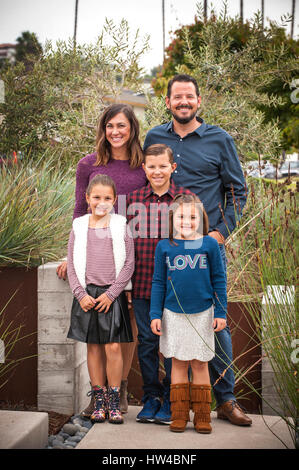 Portrait of smiling family in garden Stock Photo