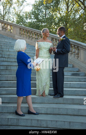 Wedding ceremony on stone staircase Stock Photo