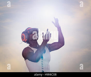 Strong man using virtual reality helmet Stock Photo