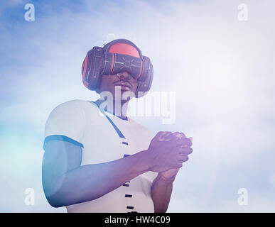 Strong man wearing virtual reality helmet Stock Photo