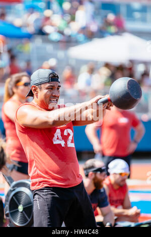 Man lifting kettlebell outdoors Stock Photo