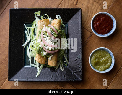 Rolled chicken taco and salsa Stock Photo
