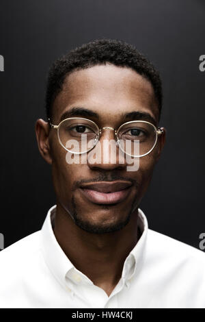 Portrait of smiling Black man wearing eyeglasses Stock Photo