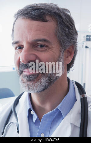 Portrait of smiling Hispanic doctor Stock Photo