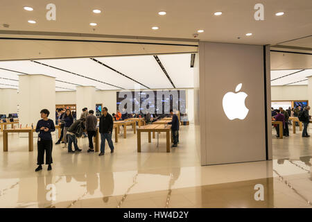 Apple Store storefront with view of interior in Hong Kong Stock Photo