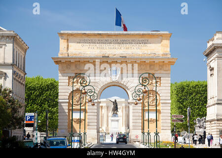 The Arc de Triomphe and statue of Louis XIV, Rue Foch, Montpellier in Languedoc-Roussilon, France. Stock Photo