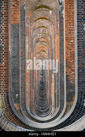 View through the brickwork and soffits of the Ouse Valley (Balcombe) Viaduct in West Sussex, UK Stock Photo