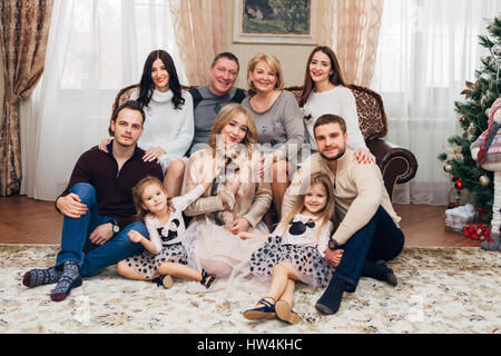 Portrait of happy family with grandparents at home Stock Photo