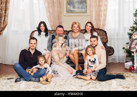 big happy family near Christmas tree Stock Photo