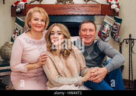 parents together with daughter teen posing for the camera Stock Photo
